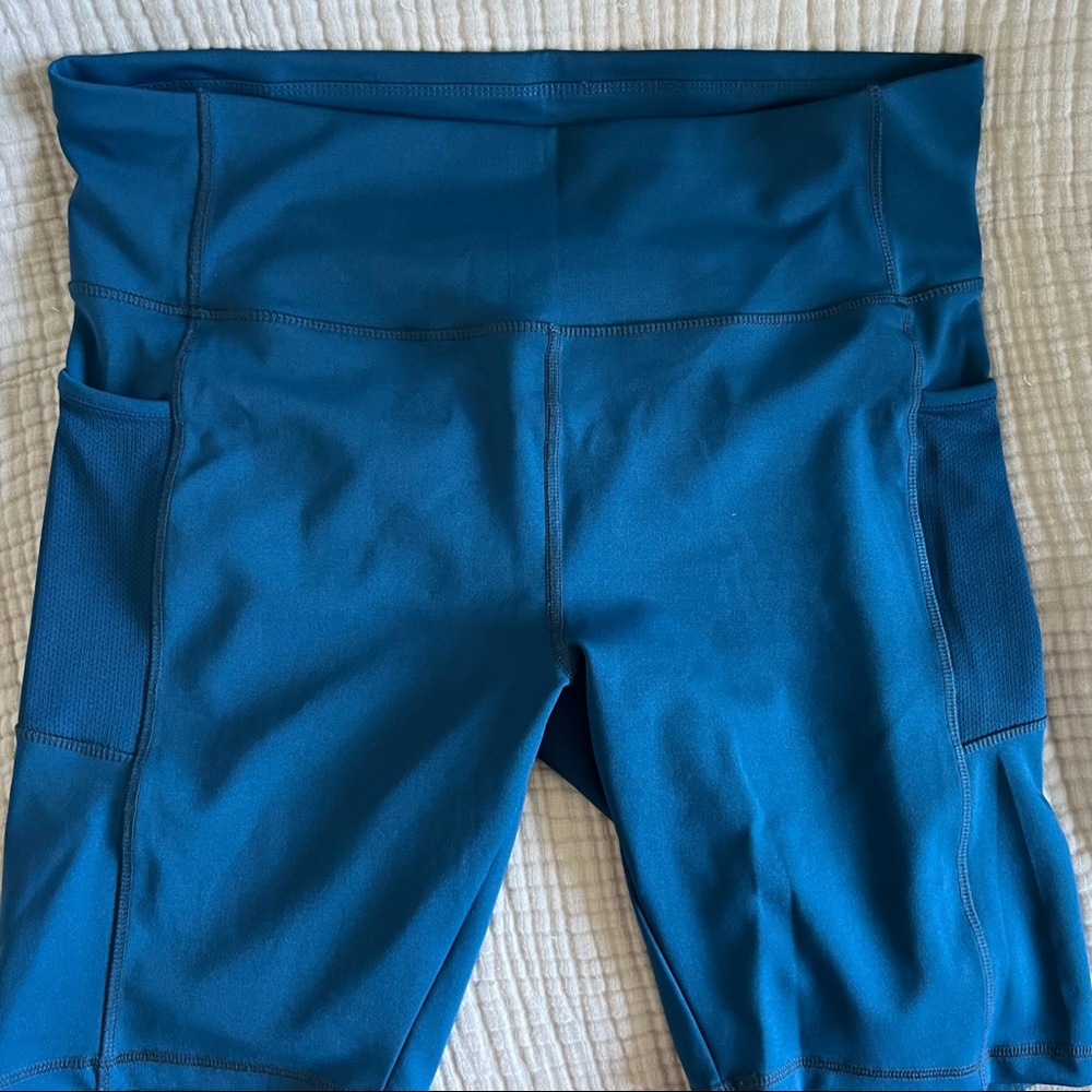 Daisy Fuentes turquoise bike shorts